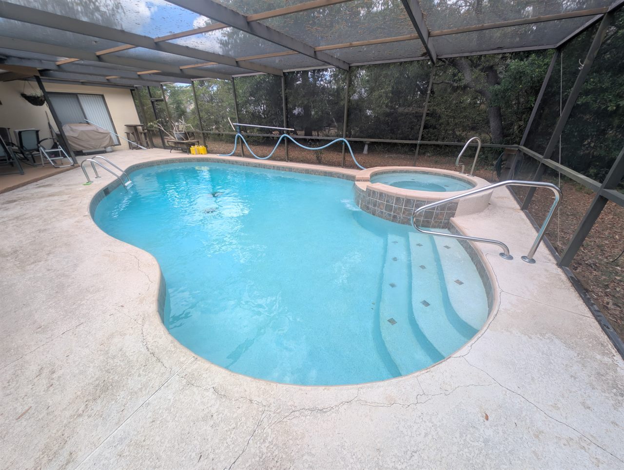 Same freeform pool after — clear blue water